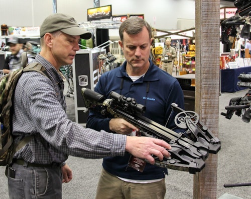 The author (left) checking out the HyperFlight EVO 420 in the Barnett booth during ATA 2020.