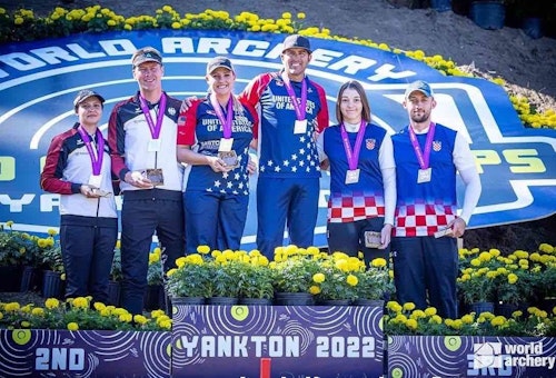Team USA’s Pearce and Cousins celebrate their compound mixed team gold.